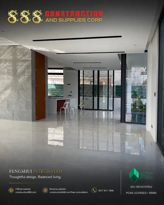 Completed project: bright open-plan interior with polished stone floors and full-height glass