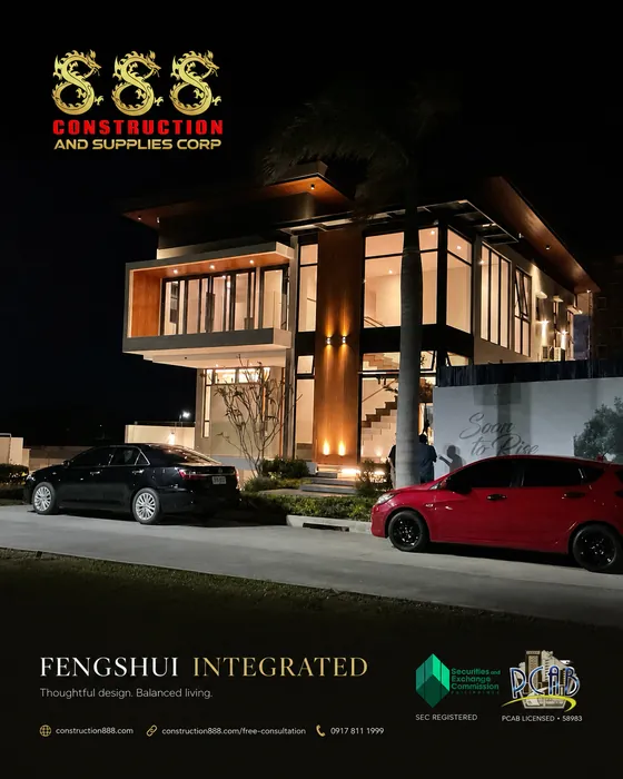 Completed project: two-storey home at night with cars in the driveway